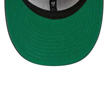 New York Islanders NHL Stanley Cup Champions Dark Grey New Era 59FIFTY Fitted Cap, inside view showing green undervisor, black sweatband, and grey taping with a New Era logo print along the seam of the structured crown.