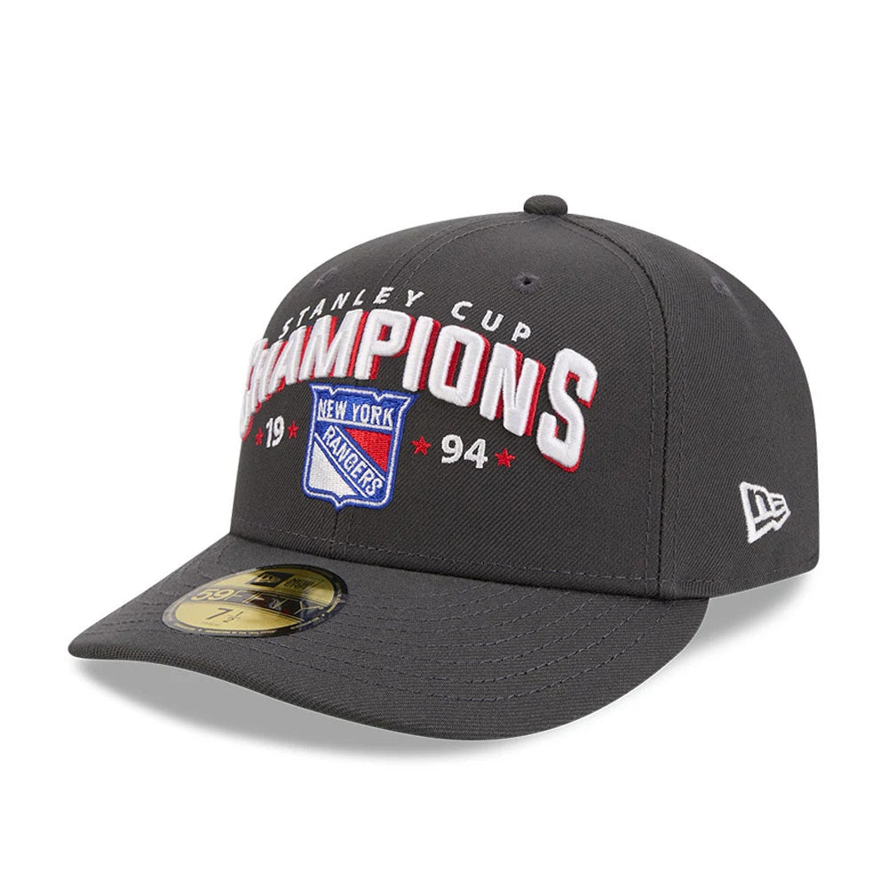 New York Rangers NHL Stanley Cup Champions Dark Grey New Era 59FIFTY Fitted Cap, three-quarter view showing a raised white and red embroidered Champions logo on the front panel, a dark grey visor with a gold 59FIFTY size sticker.