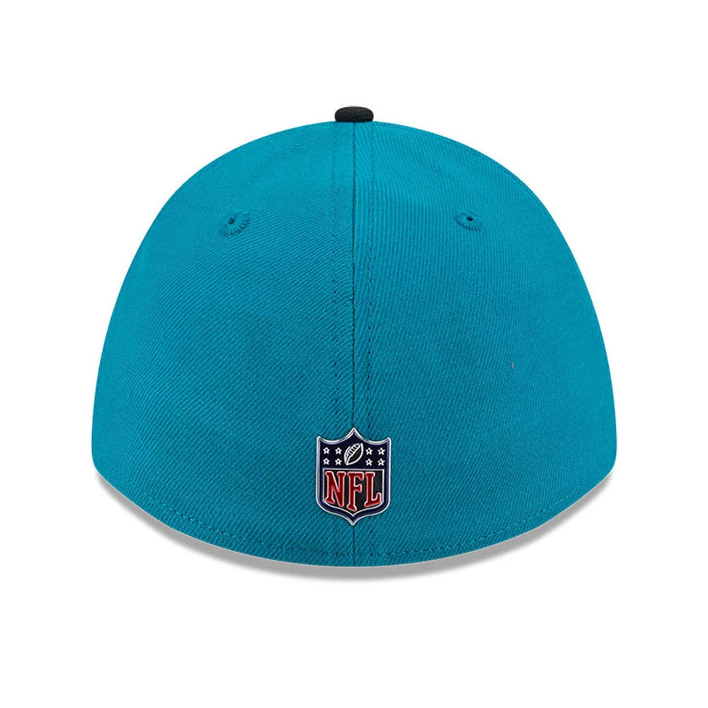 Jaguars NFL Draft 2026 Turquoise New Era 39THIRTY M-Crown Stretch Fit Cap, rear view showing the red, white, and navy embroidered NFL shield logo at the centre of the turquoise back panels, with a black top button and accented eyelets.