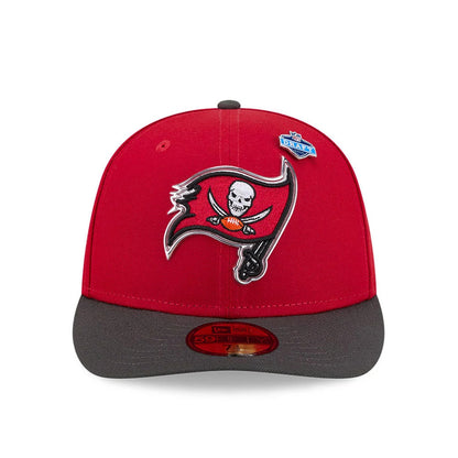 Tampa Bay Buccaneers NFL Draft 2026 Red New Era 59FIFTY Fitted Cap, front view showing the raised embroidered team logo in black, red, and white on the red crown, with a grey flat visor and gold 59FIFTY size sticker underneath.
