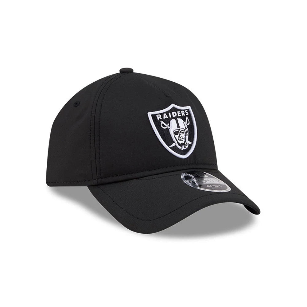 Raiders NFL Quickstrike Black New Era 9FORTY Apex Adjustable Cap, front view showing the raised embroidered white Raiders shield logo on the front panel, black curved visor with a 9FORTY size sticker, and structured black crown with matching eyelets.