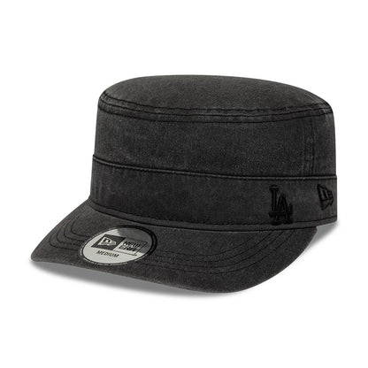 New Era LA Dodgers MLB Military Quickstrike Black Military Cap, three-quarter view showing the black embroidered LA logo on the front panel, a black New Era flag logo on the left side, and a New Era size sticker on the black curved visor.