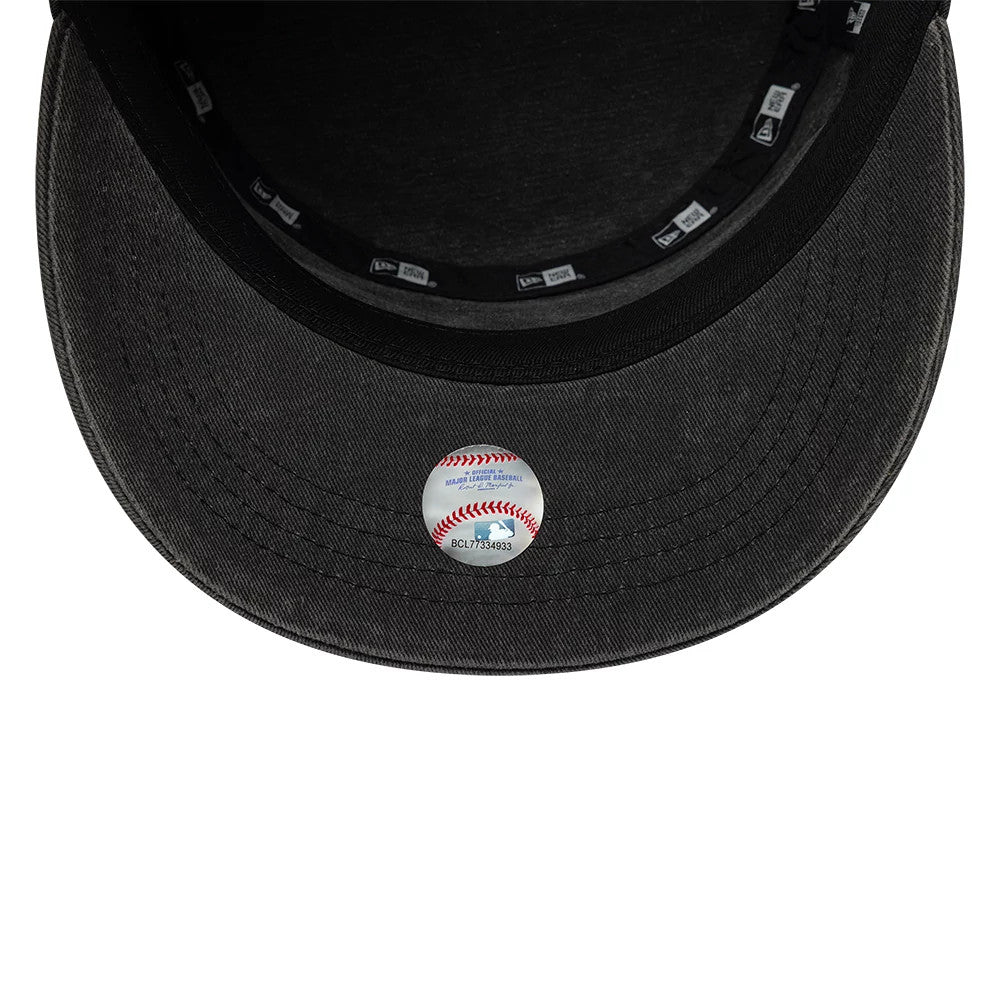 New Era LA Dodgers MLB Military Quickstrike Black Military Cap, inside view showing the black fabric sweatband, New Era branded taping around the interior, and a decorative baseball sticker placed on the grey undervisor.