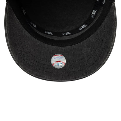 New Era LA Dodgers MLB Military Quickstrike Black Military Cap, inside view showing the black fabric sweatband, New Era branded taping around the interior, and a decorative baseball sticker placed on the grey undervisor.