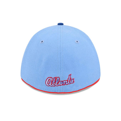 Atlanta Braves MLB City Connect Blue New Era 39THIRTY M-Crown Stretch Fit Cap, rear view showing the embroidered red and white script Atlanta logo on the lower back panel, with a contrasting red edge above the visor and a blue top button.