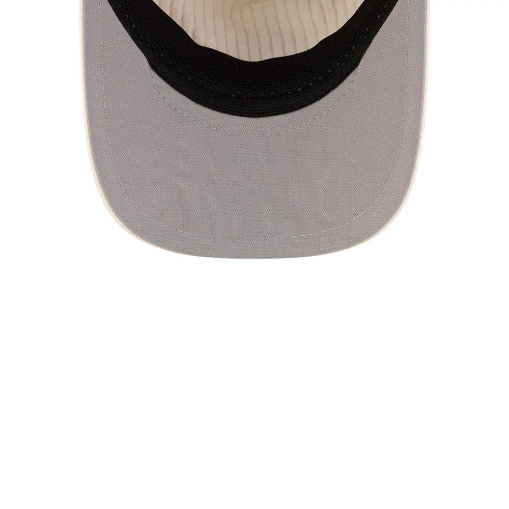 New Era Light Beige 9FORTY Apex Cap, inside view showing beige sweatband and striped taping beneath the cap, with the black interior band contrasting against the light landscape, highlighting craftsmanship and design detail.