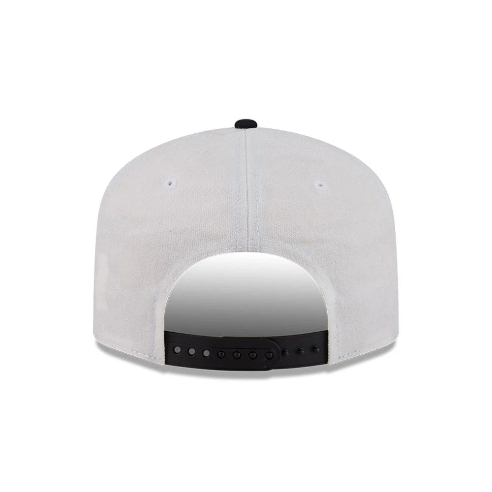 Las Vegas Raiders NFL Duck Cloth White New Era 19TWENTY Adjustable Cap, rear view showing the black adjustable snap closure, soft white duck cloth fabric on the back panels, and a black top button contrasting against the structured design.
