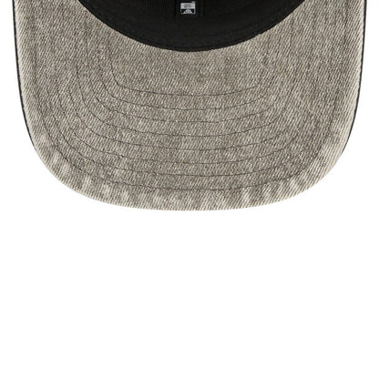 Las Vegas Raiders NFL Washed Denim Dark Grey New Era 9SEVENTY Stretch Snap Cap, inside view showing the washed denim dark grey undervisor with stitching, a black sweatband and the New Era taping across the interior.