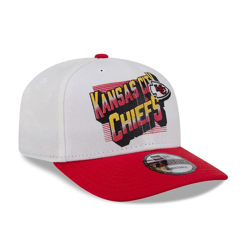 Kansas City Chiefs NFL Duck Cloth White New Era 9SEVENTY Stretch Snap Cap, front view showing raised Kansas City Chiefs text in red and yellow on the front panel, a red visor with a 9SEVENTY size sticker, and a red top button.