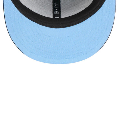 Dexter's Laboratory Electric Black New Era 59FIFTY Fitted Cap, inside view showing a blue undervisor, black taping with a 59FIFTY label, and a grey sweatband lining the interior of the structured crown.