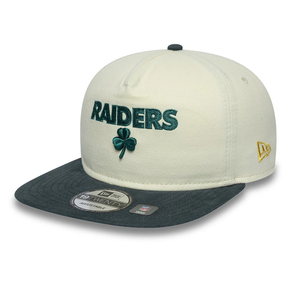 Las Vegas Raiders NFL Metallic Logo Cream New Era 19TWENTY Adjustable Cap, three-quarter view showing raised dark green Raiders script and a shamrock logo on the cream front panel, a dark visor with a 19TWENTY size sticker.
