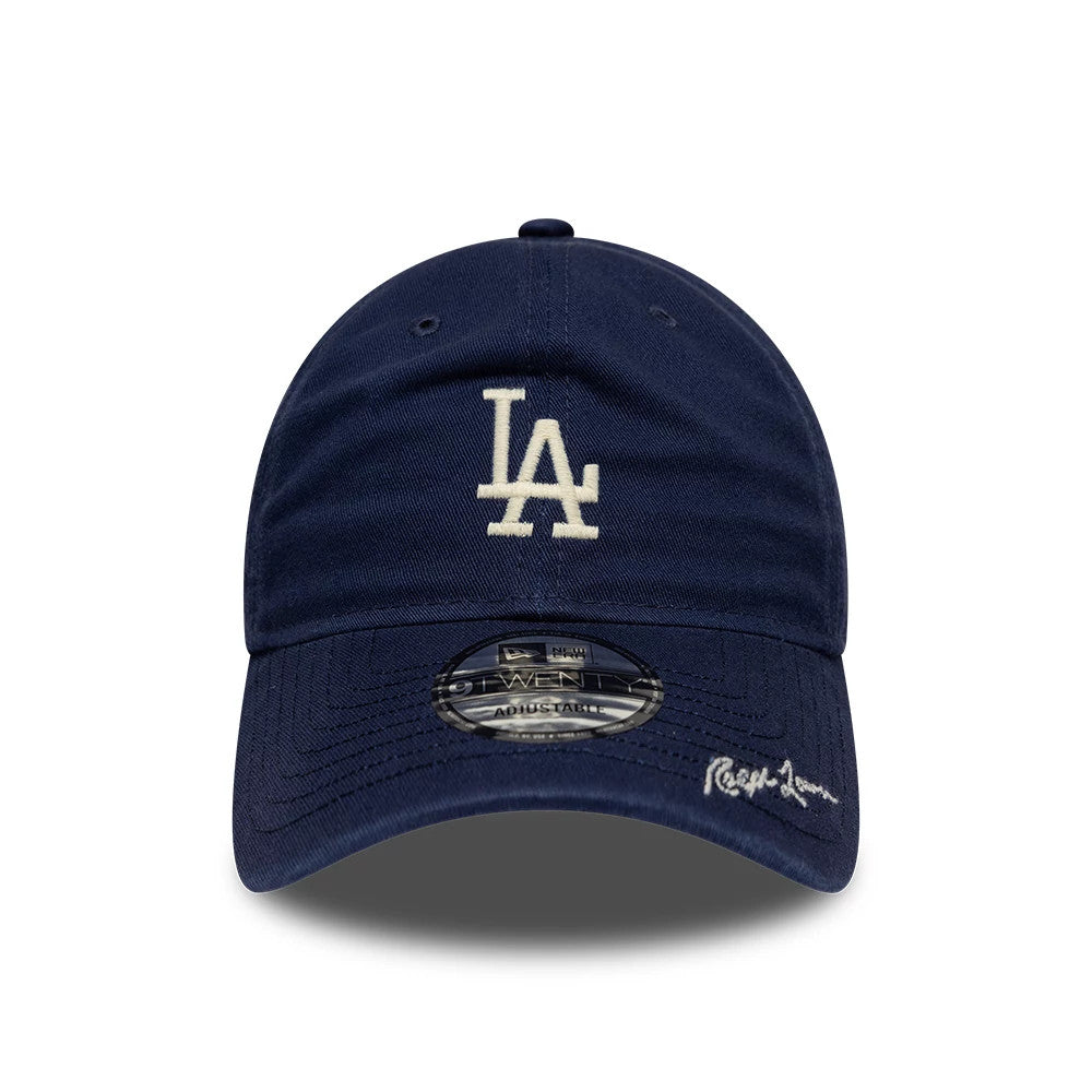 LA Dodgers Ralph Lauren X MLB Navy New Era 9TWENTY Adjustable Cap, front view showing the white embroidered LA logo on the unstructured navy crown, with a 9TWENTY size sticker and Ralph Lauren script signature on the curved visor.