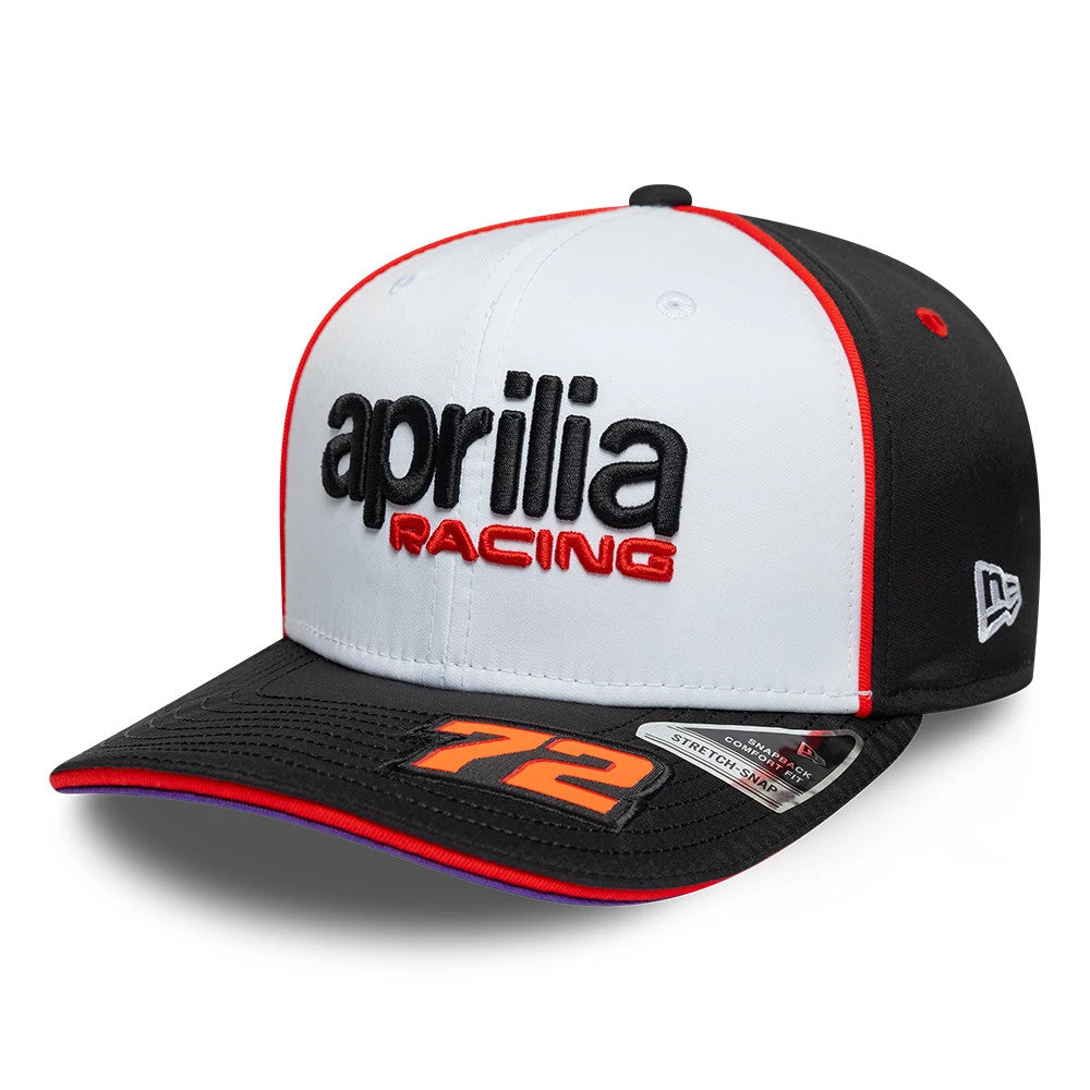 Aprilia Replica Marco Bezzecchi White New Era 9SEVENTY Stretch Snap Adjustable Cap, front view showing raised black and red embroidery of the Aprilia Racing logo on the structured white crown, black visor with orange number 72.