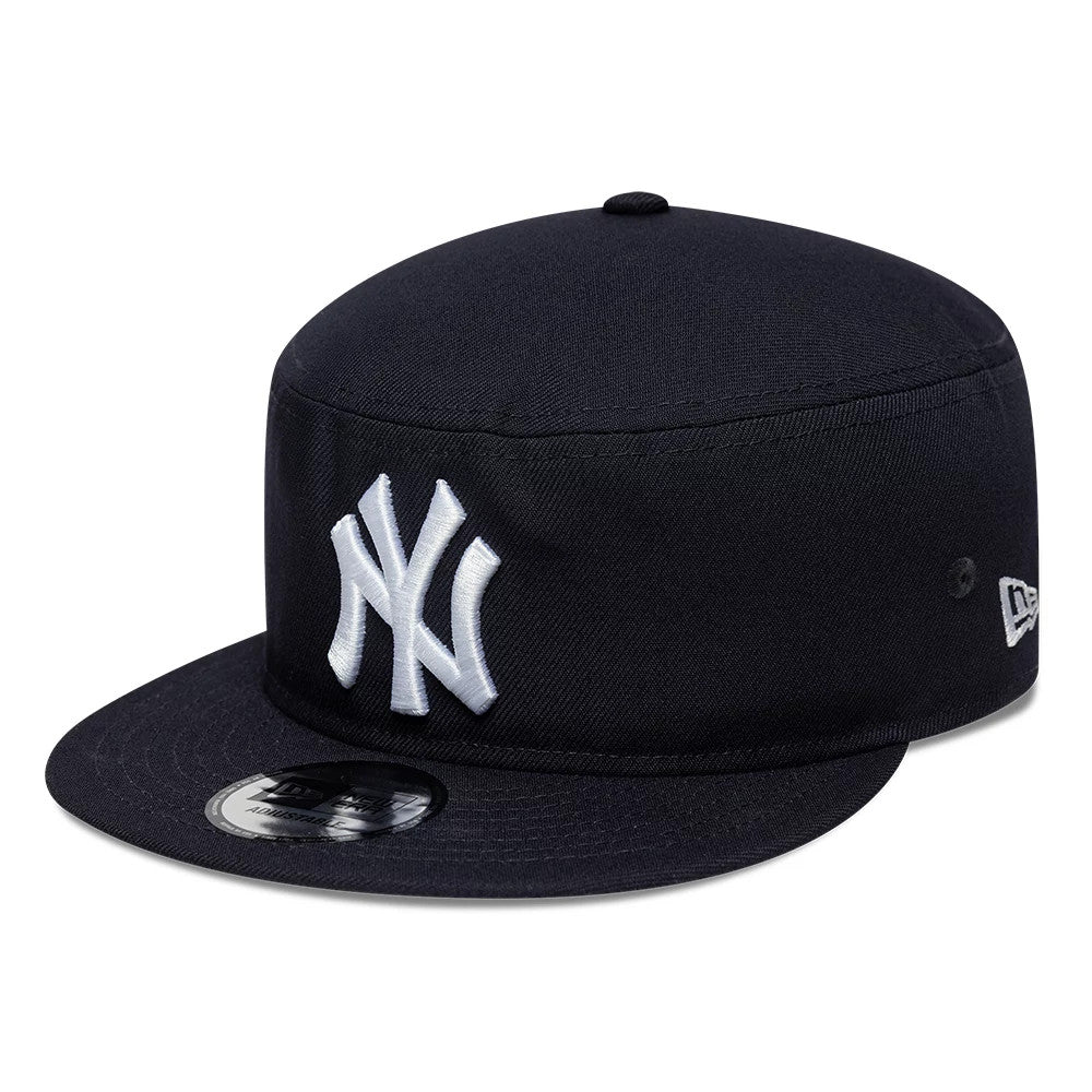 New Era New York Yankees MLB Poly Navy Pillbox Adjustable Cap, three-quarter view showing the white raised embroidered NY logo on the front panel, a black flat visor with an MLB sticker, and the New Era flag logo on the left side.