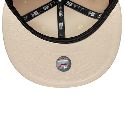 LA Dodgers MLB Satin Cream New Era 59FIFTY Fitted Cap, inside view showing the cream undervisor with a sports sticker, black taping with white 59FIFTY logos, and stitching details on the visor.