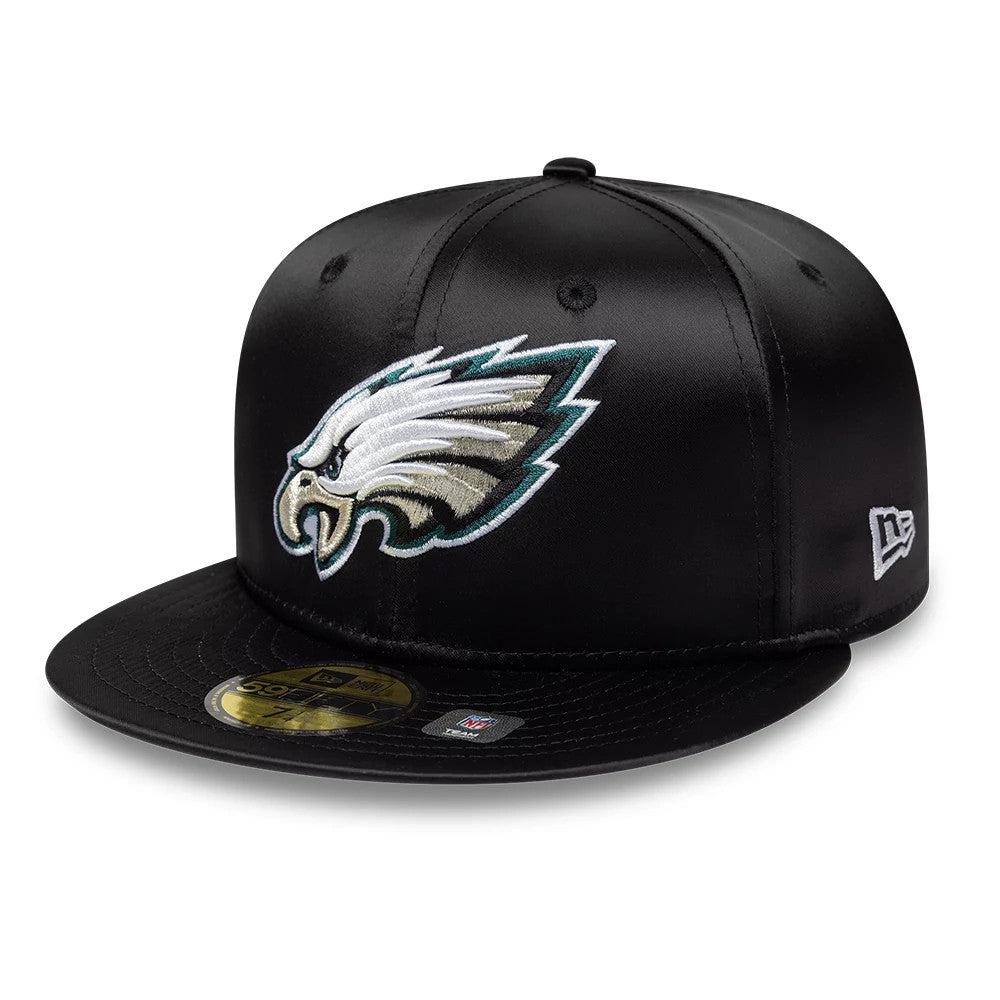 Philadelphia Eagles NFL Satin Black New Era 59FIFTY Fitted Cap, front view showing the raised embroidered Eagles logo in white and green on the black front panel, a black visor with a gold 59FIFTY size sticker.