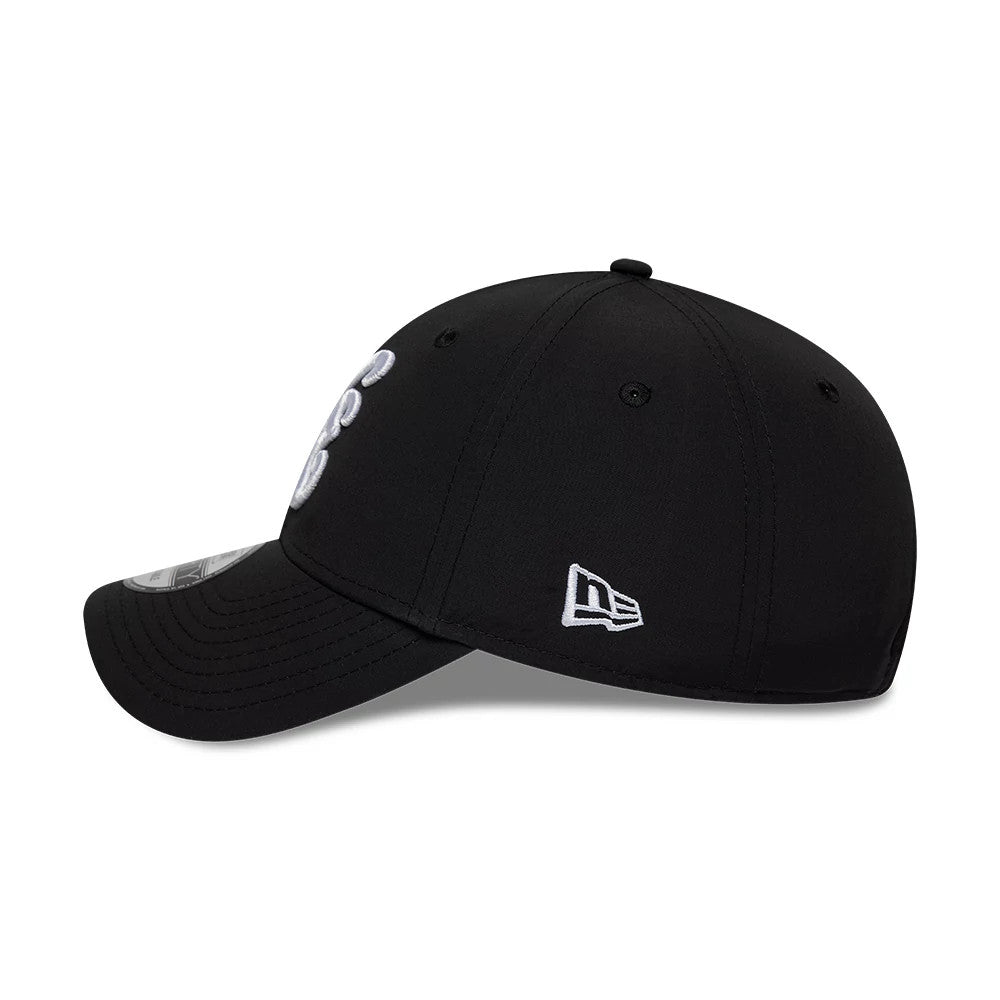 New Era Recycled Black 9FORTY Adjustable Cap, side view showing the white embroidered New Era flag logo on the left side of the structured black crown, with curved black visor and 9FORTY size sticker on the top of the visor.