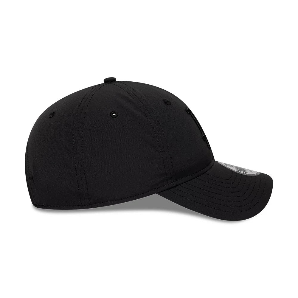 LA Dodgers MLB Recycled Black On Black New Era 9TWENTY Adjustable Cap, side view showing a curved black visor with stitching, a black embroidered logo on the low-profile structured crown, and a 9TWENTY size sticker on the visor.