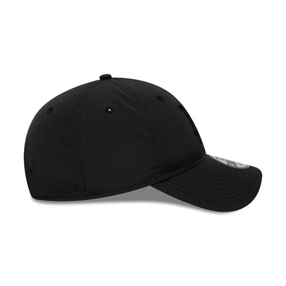 LA Dodgers MLB Recycled Black On Black New Era 9TWENTY Adjustable Cap, side view showing a curved black visor with stitching, a black embroidered logo on the low-profile structured crown, and a 9TWENTY size sticker on the visor.