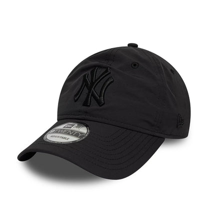 New York Yankees MLB Recycled Black On Black New Era 9TWENTY Adjustable Cap, front view showing the all-black embroidered NY logo on the unstructured crown, curved black visor with a 9TWENTY size sticker, and New Era flag logo on the left side.