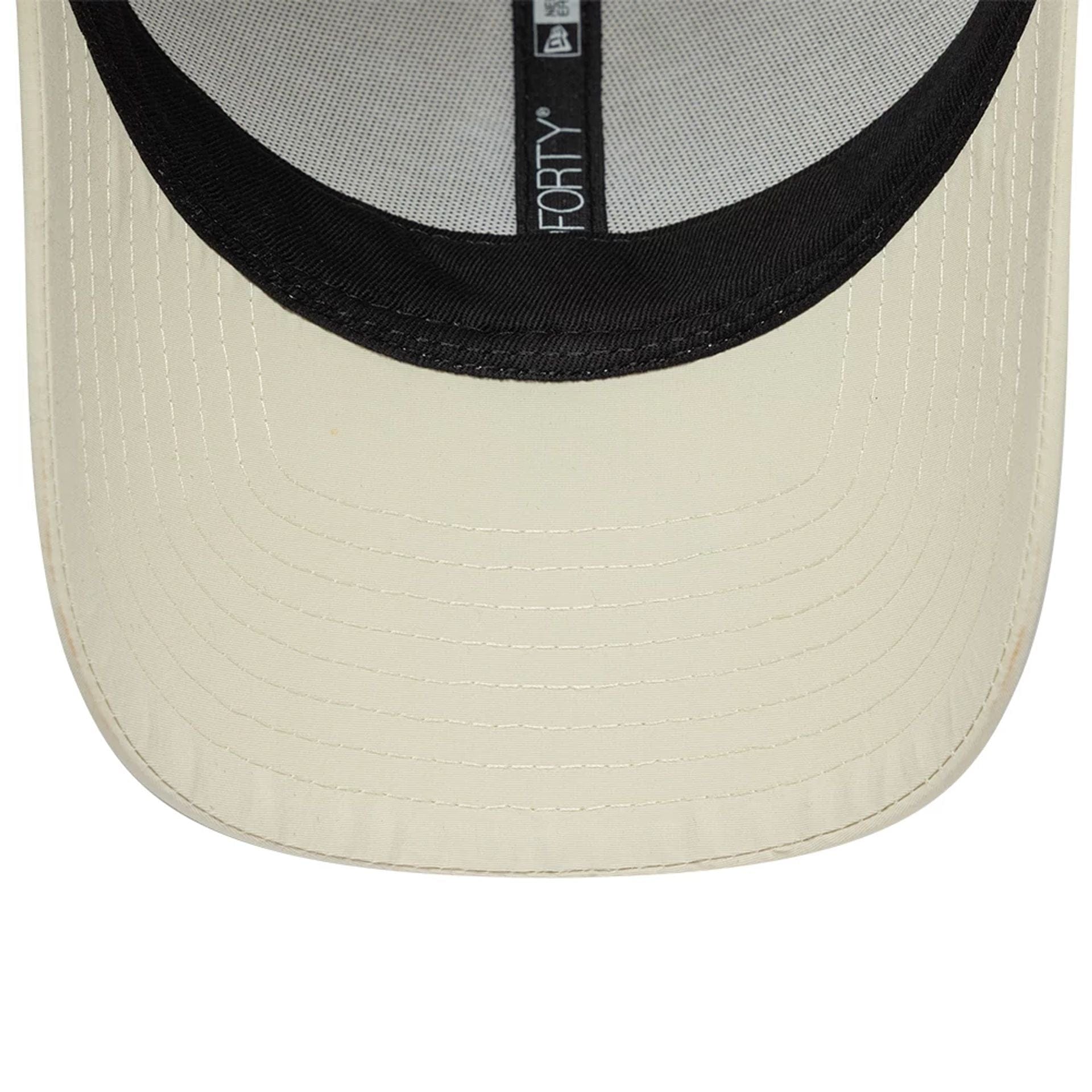 Pictured is this New Era Mini Logo Recycled 9FORTY cap in light beige. 7