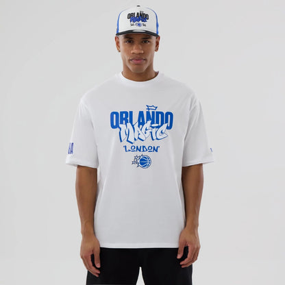 The model is wearing this NBA London Game 2026 Orlando Magic Oversized T-Shirt in white. 1