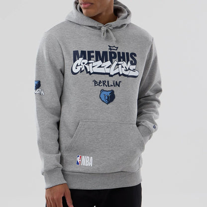 The model is wearing this NBA Berlin Game 2026 Memphis Grizzlies Pullover Hoodie in grey. 4