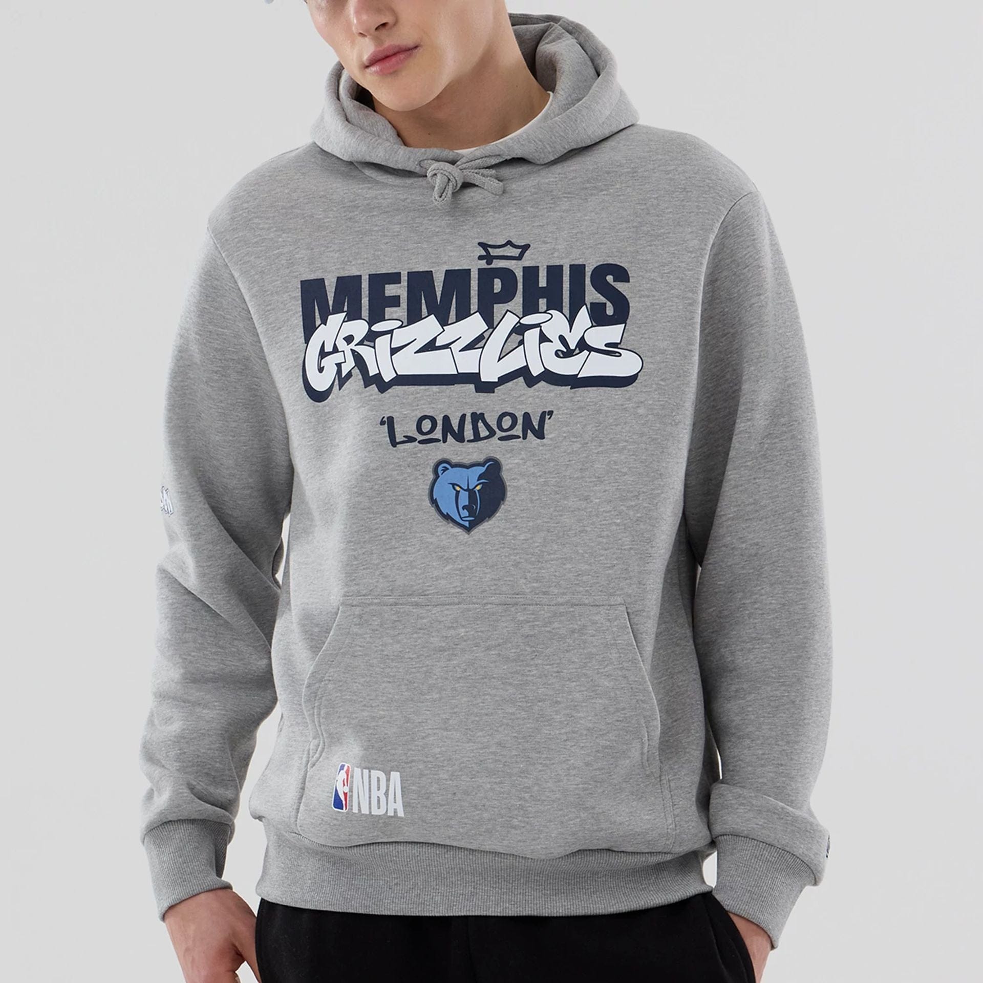 The model is wearing this NBA London Game 2026 Memphis Grizzlies Pullover Hoodie in grey. 5
