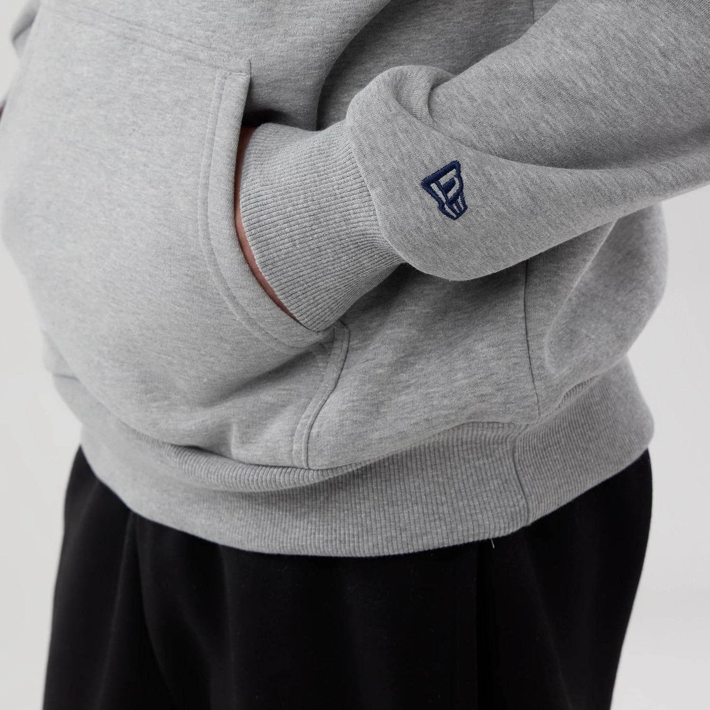 The model is wearing this NBA London Game 2026 Memphis Grizzlies Pullover Hoodie in grey. 4