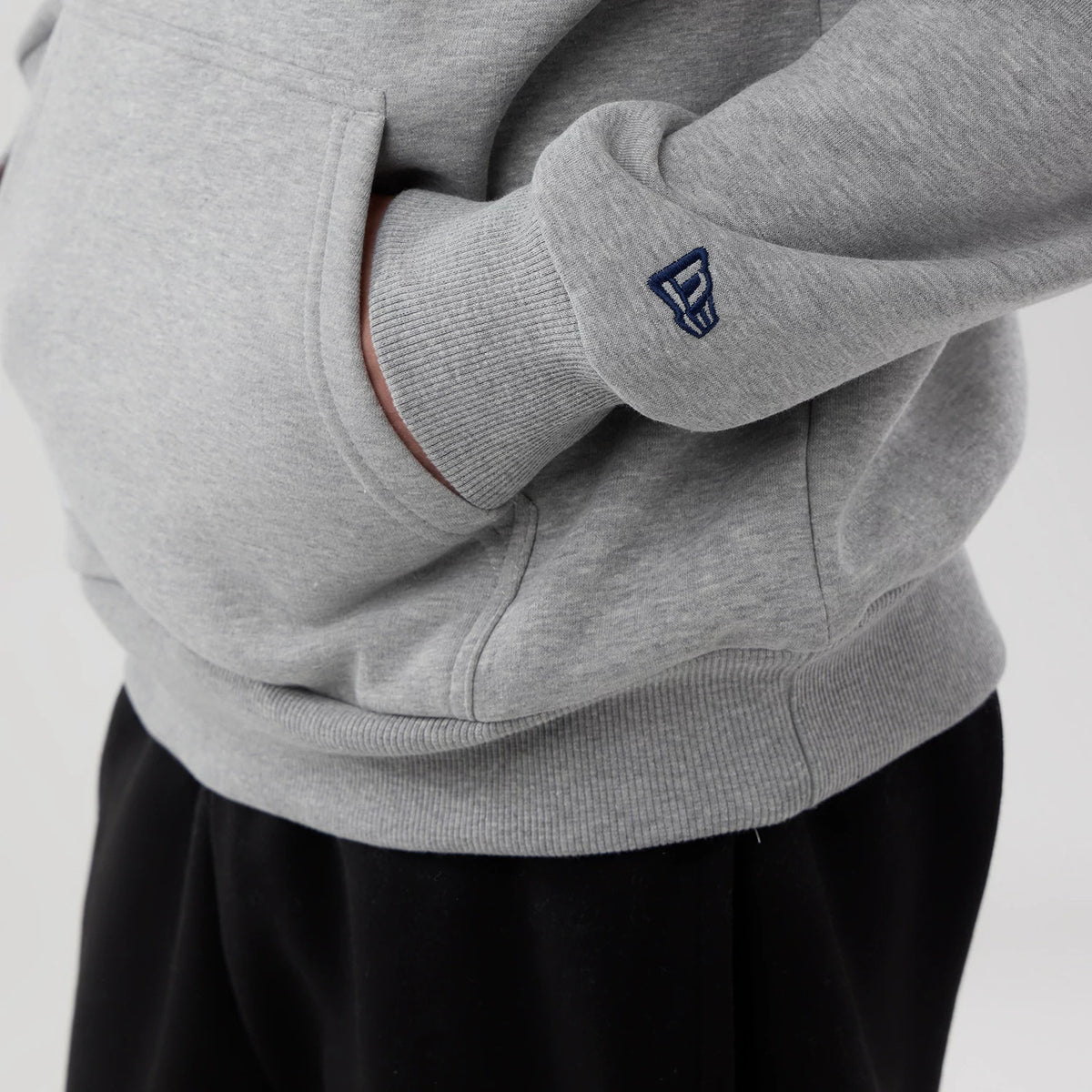 The model is wearing this NBA London Game 2026 Memphis Grizzlies Pullover Hoodie in grey. 4