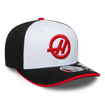 Pictured is this Oliver Bearman TGR Haas F1 9SEVENTY Stretch Snap cap in black. 4