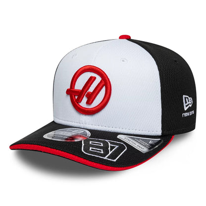 Pictured is this Oliver Bearman TGR Haas F1 9SEVENTY Stretch Snap cap in black. 1