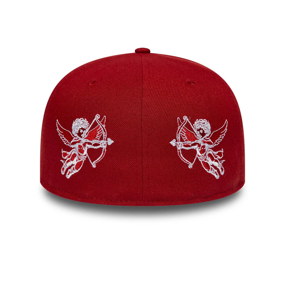 New Era Cherub Dark Red 59FIFTY Fitted Cap, rear view showing two intricately embroidered white cherub graphics holding bows on the red structured crown, with eyelets and a top button enhancing the elegant design.
