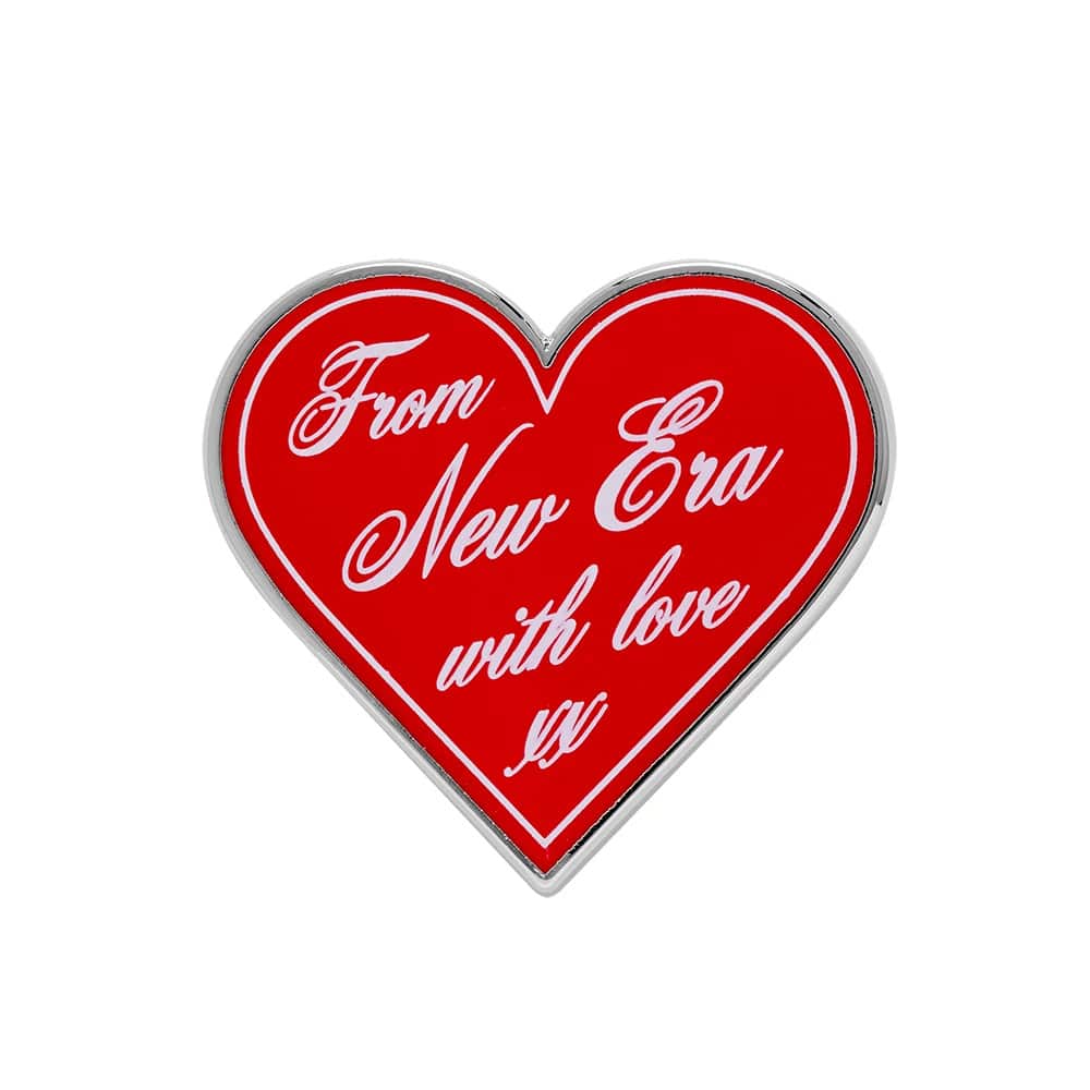 Pictured is this New Era Heart Script Pin Badge in silver. 1