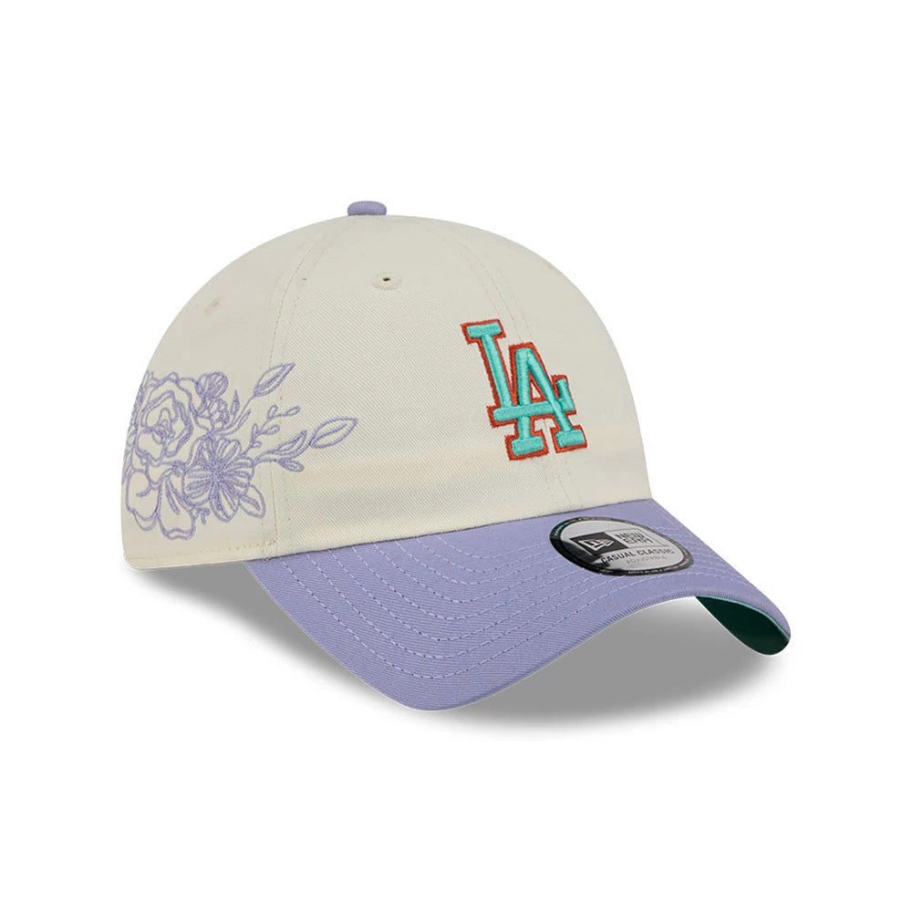 New Era LA Dodgers MLB Lavender Flowers White Casual Classic Adjustable Cap, three-quarter view showing a turquoise and red embroidered LA logo centred on the front panel, lavender floral design on the side.