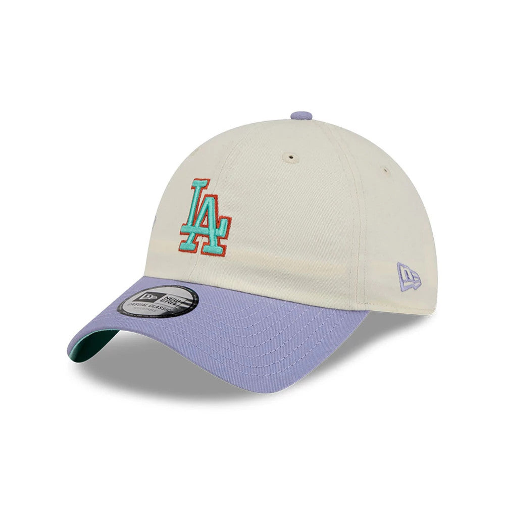 New Era LA Dodgers MLB Lavender Flowers White Casual Classic Adjustable Cap, three-quarter view showing the turquoise and pink embroidered LA logo on the front panel, complemented by a lavender curved visor.