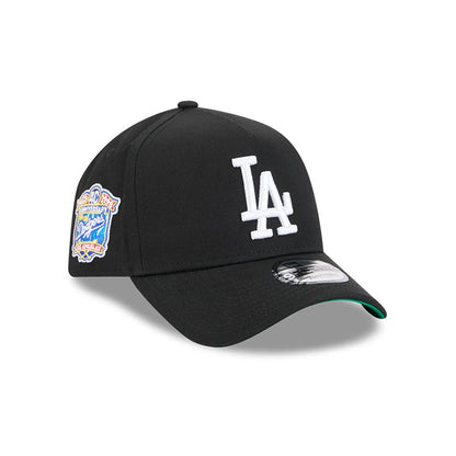 Dodgers MLB Cooperstown Anniversary Black New Era 9FORTY A-Frame Adjustable Cap, three-quarter view featuring a raised white LA logo embroidered on the front panel, the Cooperstown Anniversary patch on the left side.