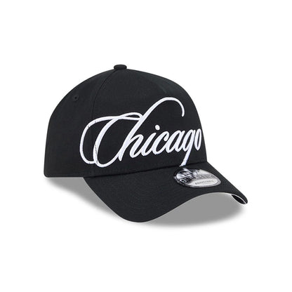 Chicago White Sox MLB Calligraphy Black New Era 9FORTY A-Frame Adjustable Cap, three-quarter view showing the white embroidered Chicago script on the front panel, curved black visor with a 9FORTY size sticker, and a structured black crown.