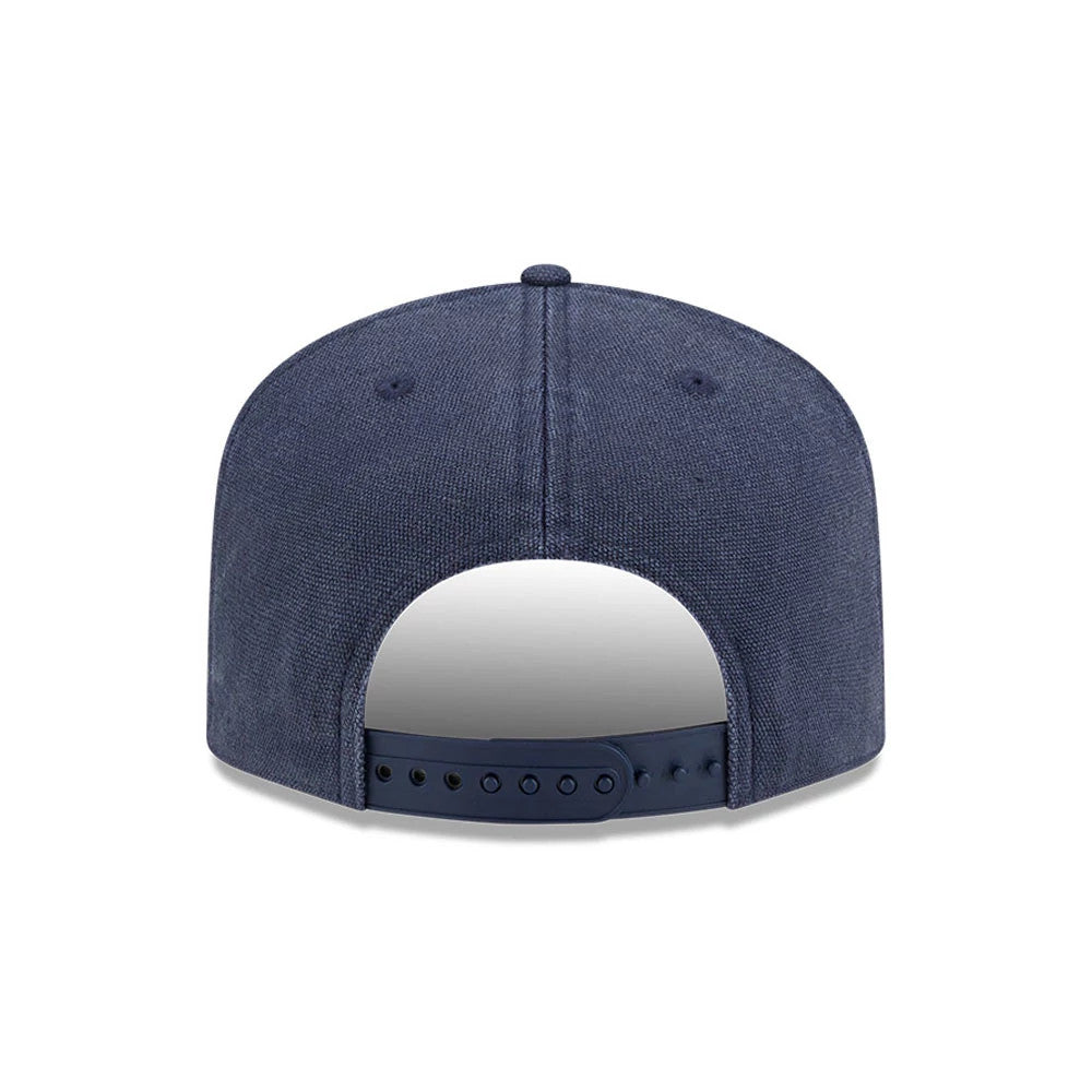 New York Yankees MLB Duck Canvas Navy New Era 19TWENTY Adjustable Cap, rear view showing the absence of a back logo, adjustable snapback closure, and a navy textured crown with matching navy eyelets and a top button.