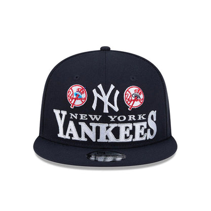 Yankees MLB Cooperstown Throwback Navy New Era 9FIFTY Snapback Adjustable Cap, front view showing two red and white Yankees Cooperstown logos and a large grey New York Yankees embroidery, with a black visor and 9FIFTY size sticker.