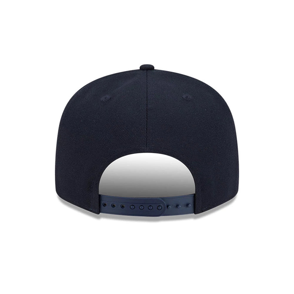 Yankees MLB Cooperstown Throwback Navy New Era 9FIFTY Snapback Adjustable Cap, rear view showing the navy crown with matching top button and two embroidered eyelets per panel above a navy adjustable snap closure.