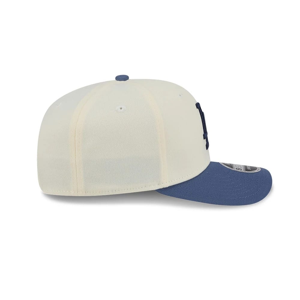 Pictured is this MLB Slate Stone LA Dodgers 9SEVENTY Stretch Snap cap in cream & dark blue. 6