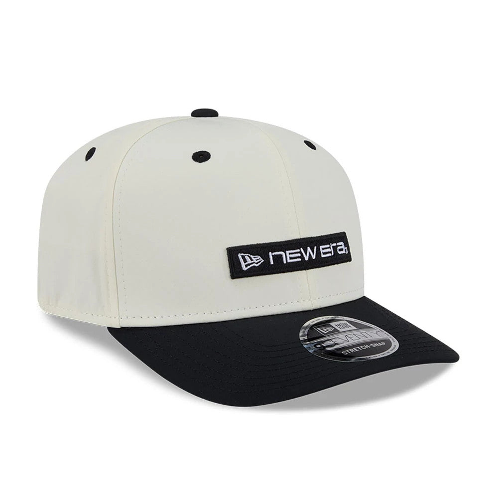 Pictured is this New Era Linear Logo 9SEVENTY Stretch Snap cap in white & black. 4