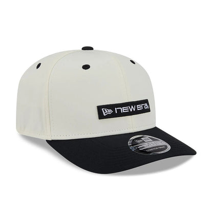Pictured is this New Era Linear Logo 9SEVENTY Stretch Snap cap in white & black. 4