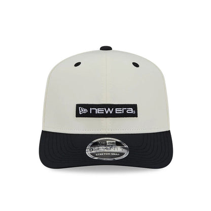 Pictured is this New Era Linear Logo 9SEVENTY Stretch Snap cap in white & black. 3