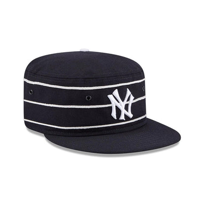 New Era New York Yankees MLB Cooperstown Navy Pillbox Adjustable Cap, front view showing the raised white embroidered NY logo on the navy front panel, with white horizontal stripes encircling the crown and a matching flat navy visor.