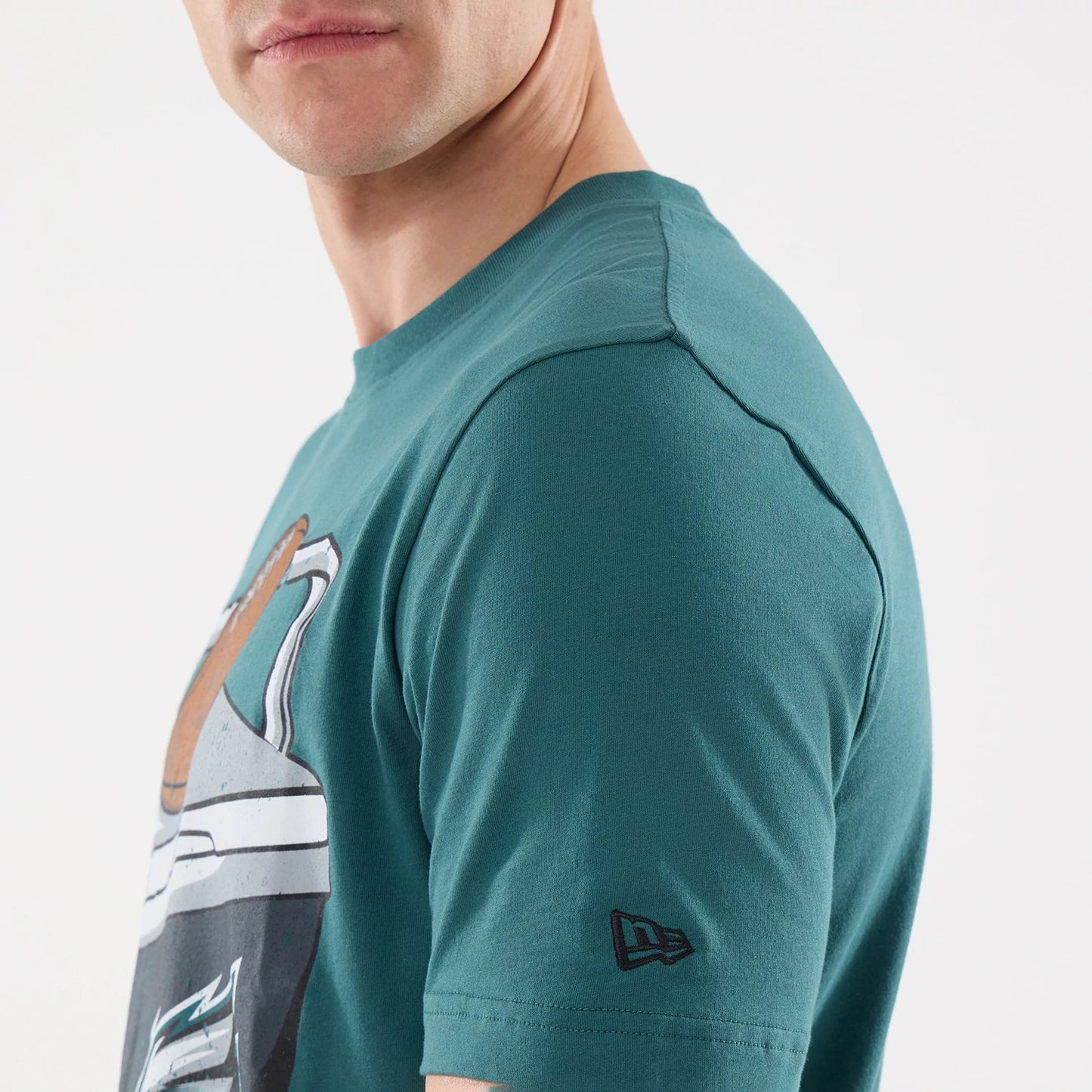 The model is wearing this NFL Training 2026 Philadelphia Eagles T-Shirt in dark green. 4