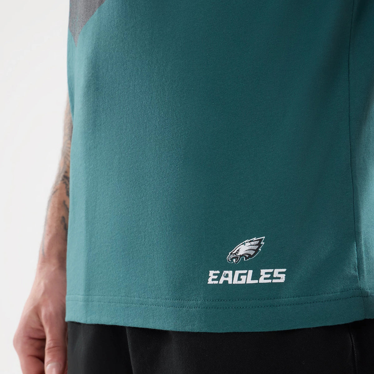 The model is wearing this NFL Training 2026 Philadelphia Eagles T-Shirt in dark green. 5