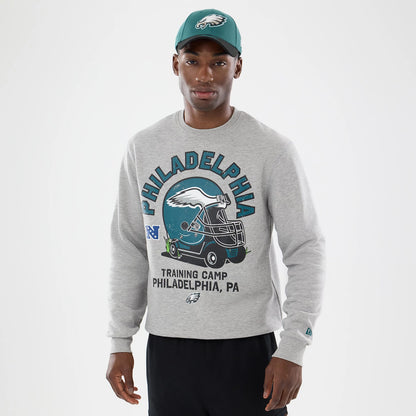 The model is wearing this NFL Training 2026 Philadelphia Eagles Crew Neck Sweater in grey. 1