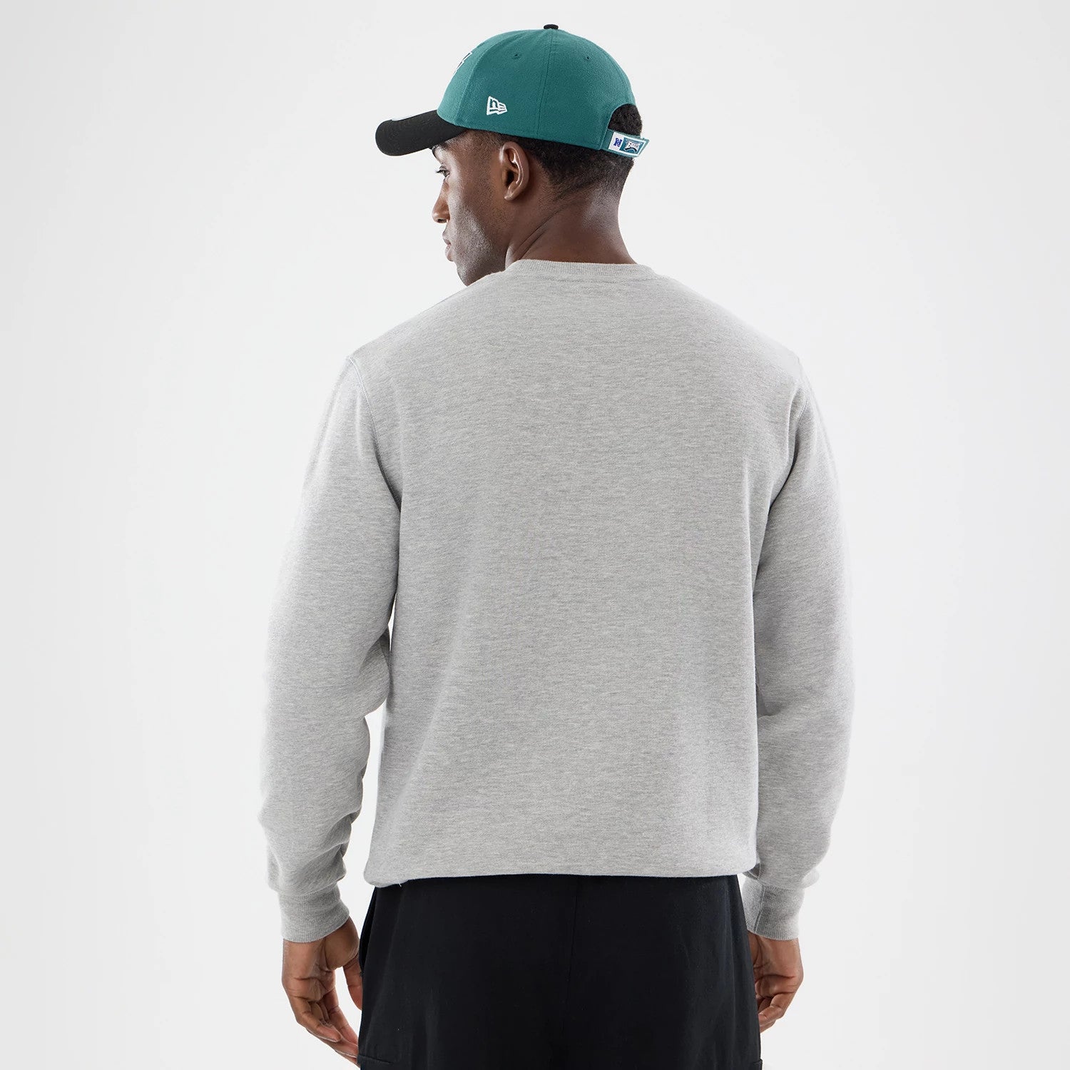 The model is wearing this NFL Training 2026 Philadelphia Eagles Crew Neck Sweater in grey. 2